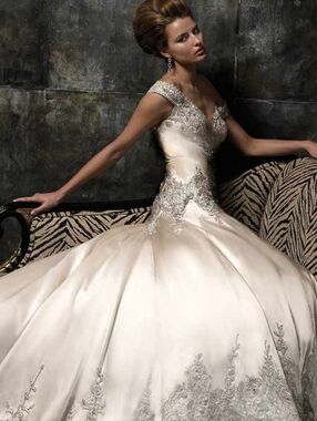 This Stephen Yearick wedding gown features a champagne silky satin, fit & flare.